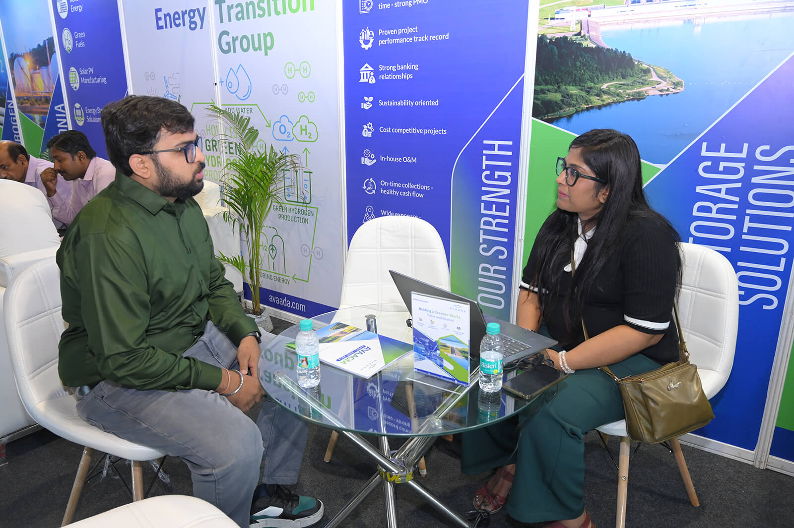 discussing renewable energy solutions during the expo